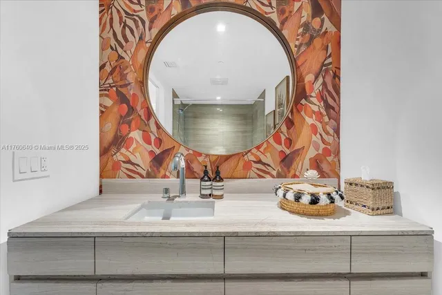 a view of a chairs and table in patio with a lake view