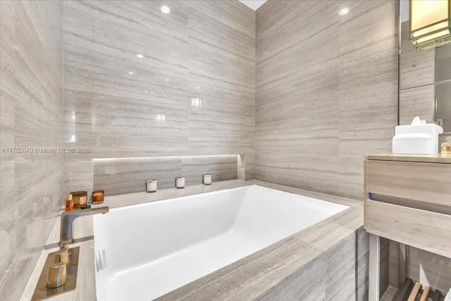 a living room with furniture and large flat screen tv