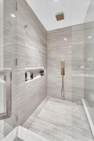 a living room with furniture and large windows