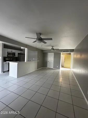 a view of a kitchen with a sink and cabinets