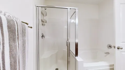 a bed room with a bed and a window