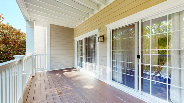 a aerial view of a house with a yard and large trees