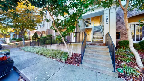 a kitchen with stainless steel appliances granite countertop a stove a sink dishwasher a refrigerator and a microwave oven