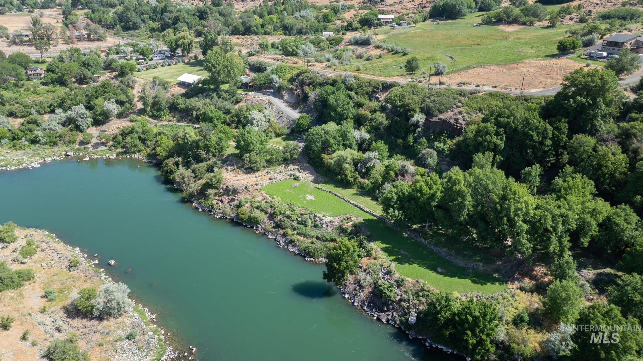 863 Pottery Road Bliss, ID 83314 - Photo 28 of 45 Expansive riverfront property featuring a broad water frontage, terraced green spaces, mature trees, and natural rock formations