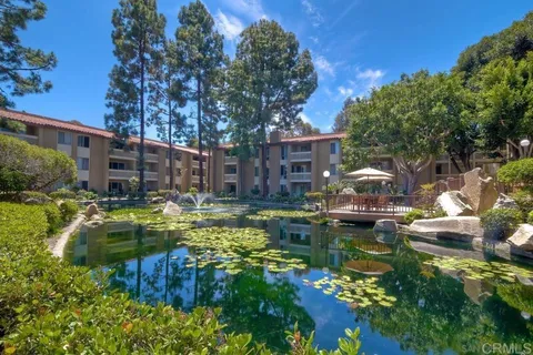 a swimming pool with outdoor seating and yard