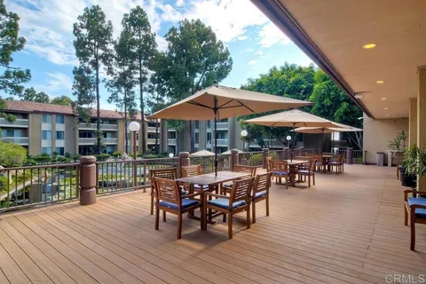 an outdoor space with furniture and umbrella