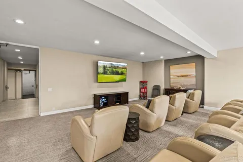 a room with pool table and windows