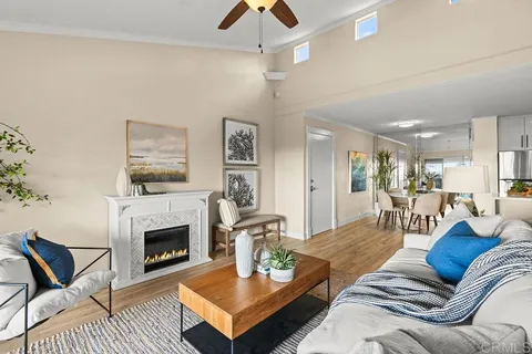 a living room with furniture a table and a fireplace