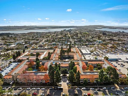 an aerial view of residential building and ocean