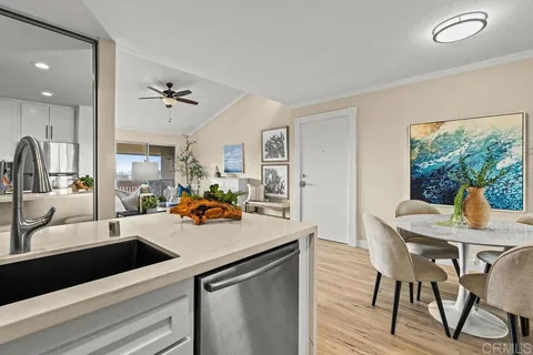 a view of a living room and dining room