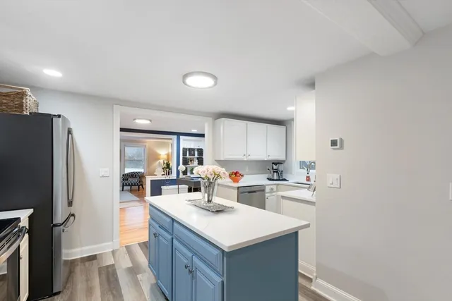 a kitchen with a sink stove and refrigerator