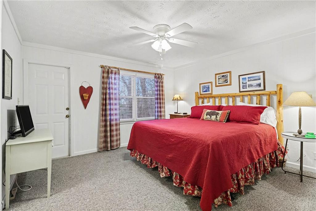 296 Fairview Court Jasper, GA 30143 - Photo 11 of 40 a bed room with a bed and a window