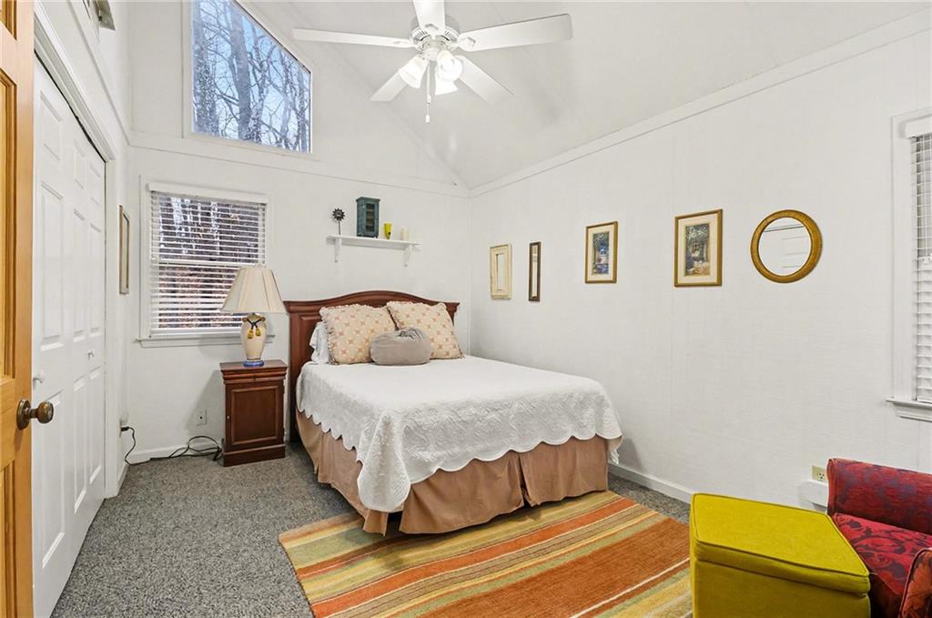 296 Fairview Court Jasper, GA 30143 - Photo 16 of 40 a bedroom with a bed and a chandelier