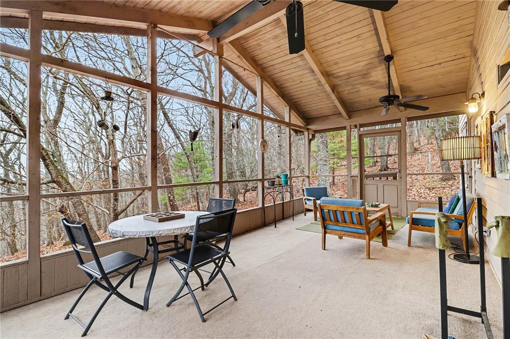 296 Fairview Court Jasper, GA 30143 - Photo 10 of 40 a dining room with furniture and a floor to ceiling window