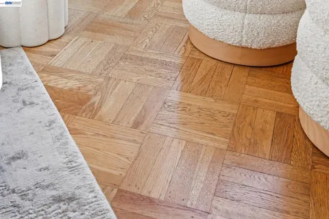 a view of a dining room with furniture wooden floor and a chandelier