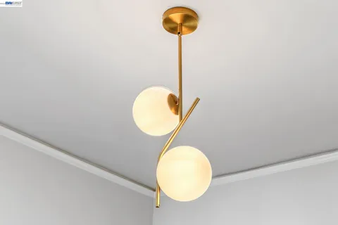 a living room with a couch and painting on the wall