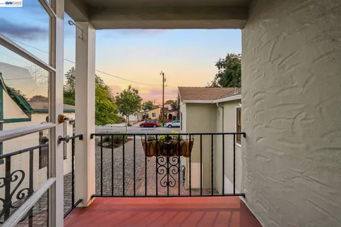 a backyard of a house with outdoor seating