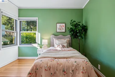 a view of a patio with table and chairs with wooden floor and fence