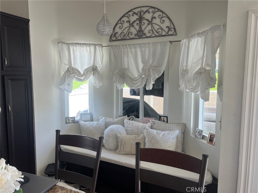 6105 Sherry Court Rancho Cucamonga, CA 91737 - Photo 13 of 35 a view of a dining room with furniture and a window