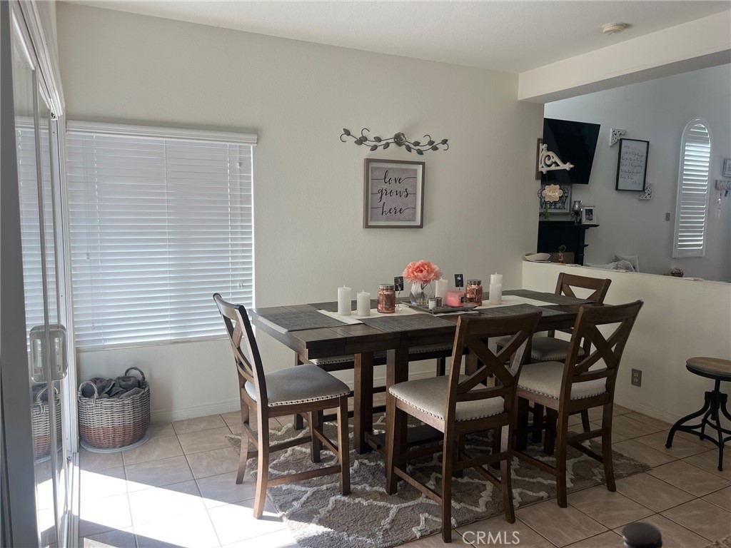 6105 Sherry Court Rancho Cucamonga, CA 91737 - Photo 15 of 35 a view of a dining room with furniture and chandelier