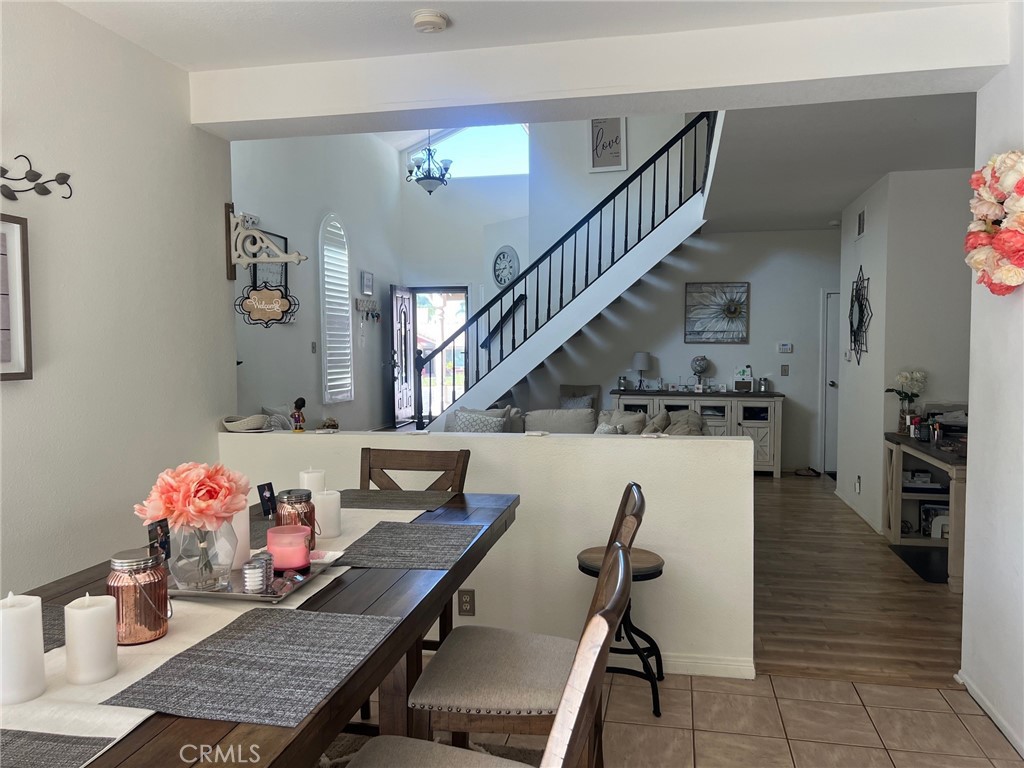 6105 Sherry Court Rancho Cucamonga, CA 91737 - Photo 16 of 35 a view of a dining room with furniture and wooden floor