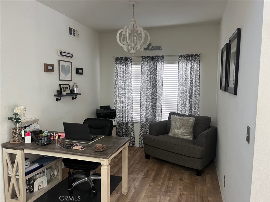 6105 Sherry Court Rancho Cucamonga, CA 91737 - Photo 19 of 35 a livingroom with workspace and a couch
