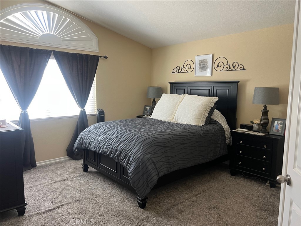 6105 Sherry Court Rancho Cucamonga, CA 91737 - Photo 22 of 35 a bedroom with a bed and a window