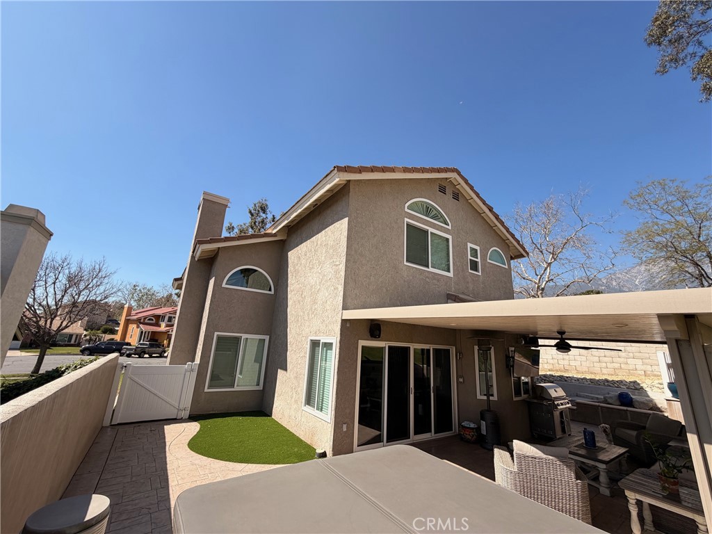 6105 Sherry Court Rancho Cucamonga, CA 91737 - Photo 32 of 35 a front view of a house with a yard