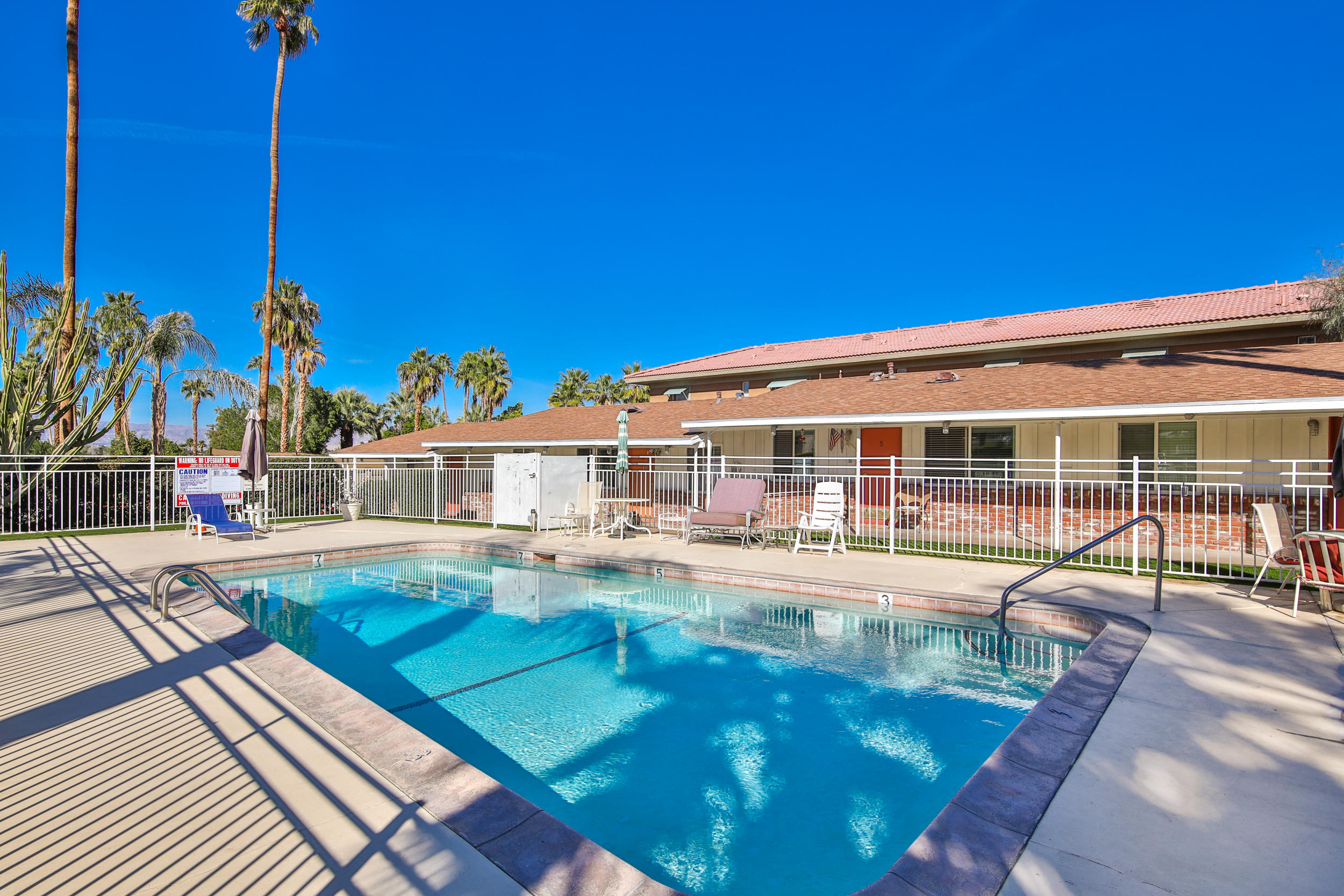 68365 Tahquitz Road Cathedral City, CA 92234 - Photo 11 of 14 a view of a house with swimming pool