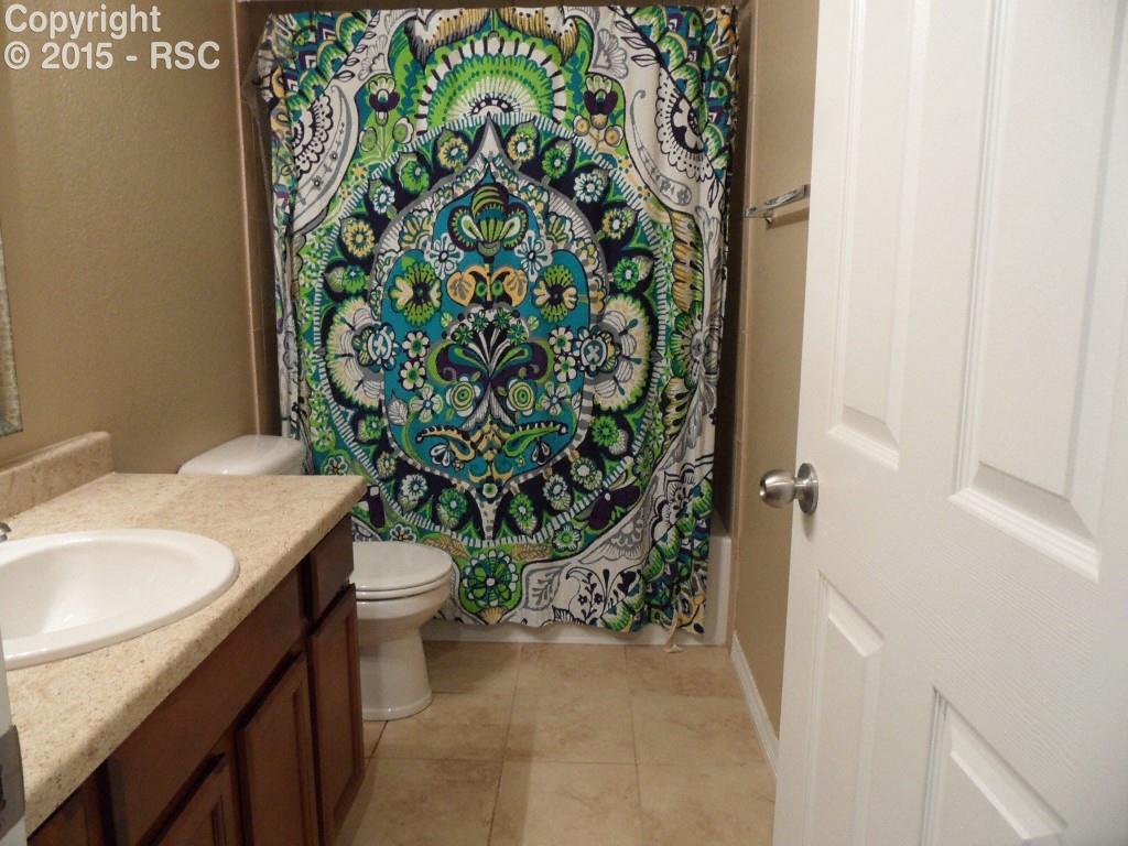 2275 Reed Grass Way Colorado Springs, CO 80915 - Photo 18 of 24 Basement bath between rooms #3 and #4