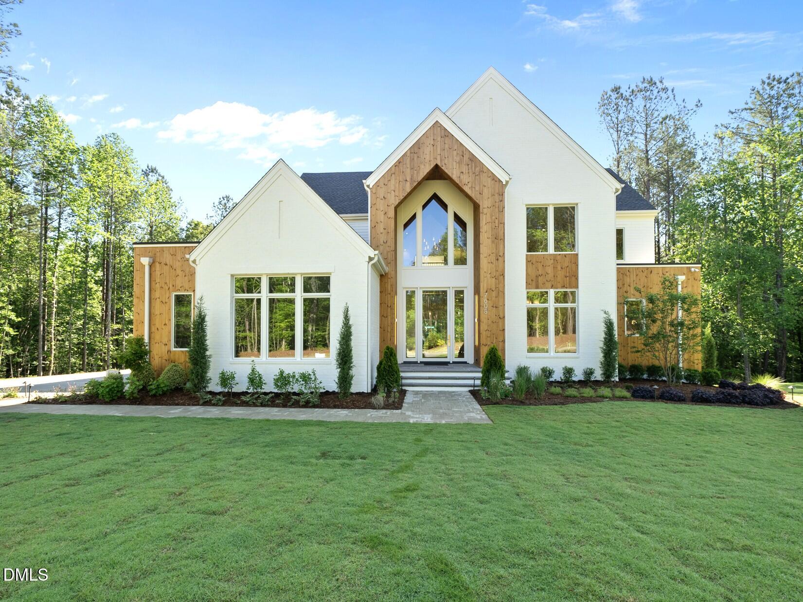 7608 Falls Creek Lane Raleigh, NC 27614 - Photo 1 of 74 a front view of a house with a yard