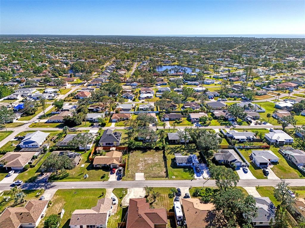 548 Morningside Road Venice, FL 34293 - Photo 20 of 22 an aerial view of a city with lots of residential buildings