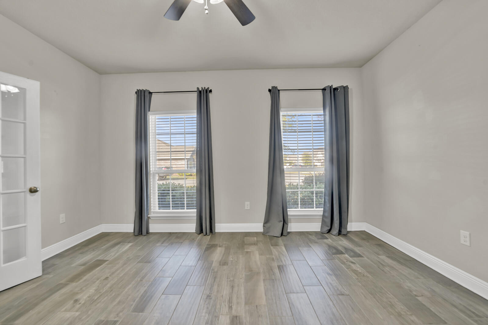 272 Lottie Loop Freeport, FL 32439 - Photo 15 of 53 an empty room with wooden floor and windows