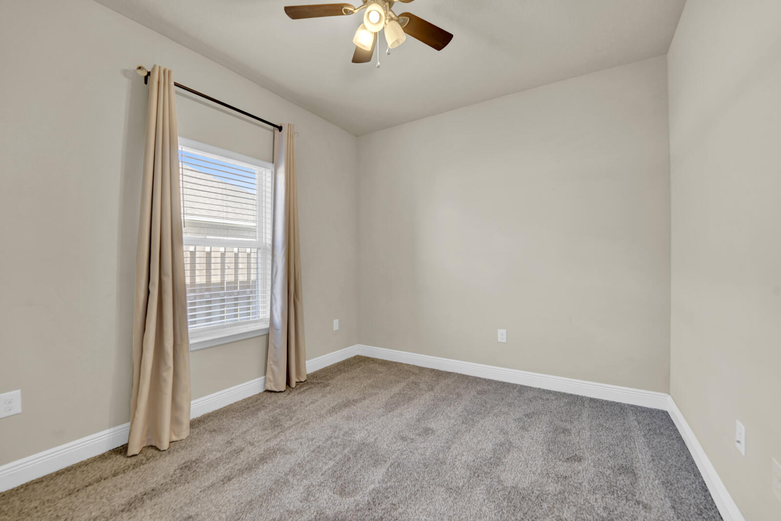 272 Lottie Loop Freeport, FL 32439 - Photo 23 of 53 an empty room with a ceiling fan and window