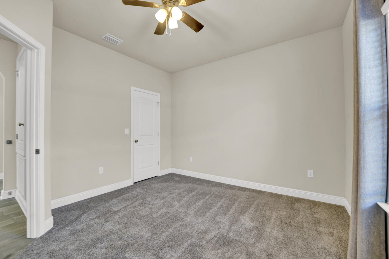 272 Lottie Loop Freeport, FL 32439 - Photo 26 of 53 a view of an empty room with a chandelier fan