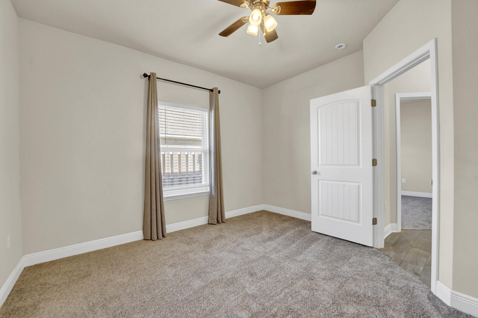 272 Lottie Loop Freeport, FL 32439 - Photo 27 of 53 a view of an empty room with a chandelier fan