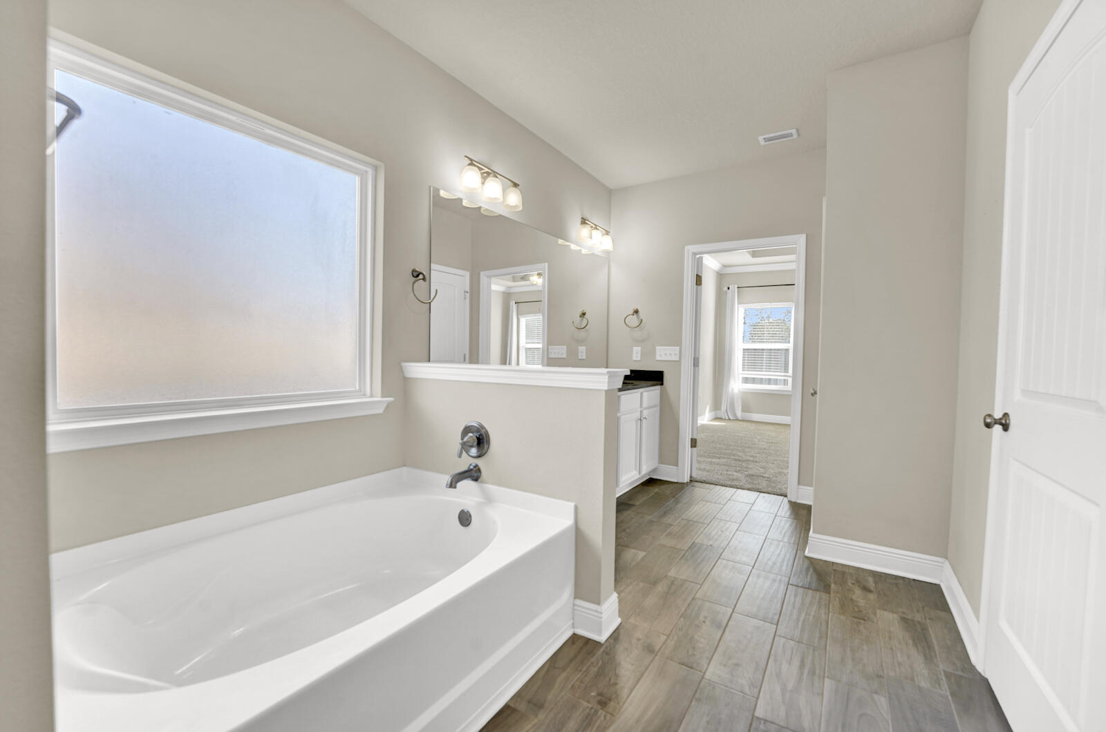 272 Lottie Loop Freeport, FL 32439 - Photo 36 of 53 a bathroom with a bathtub and a sink