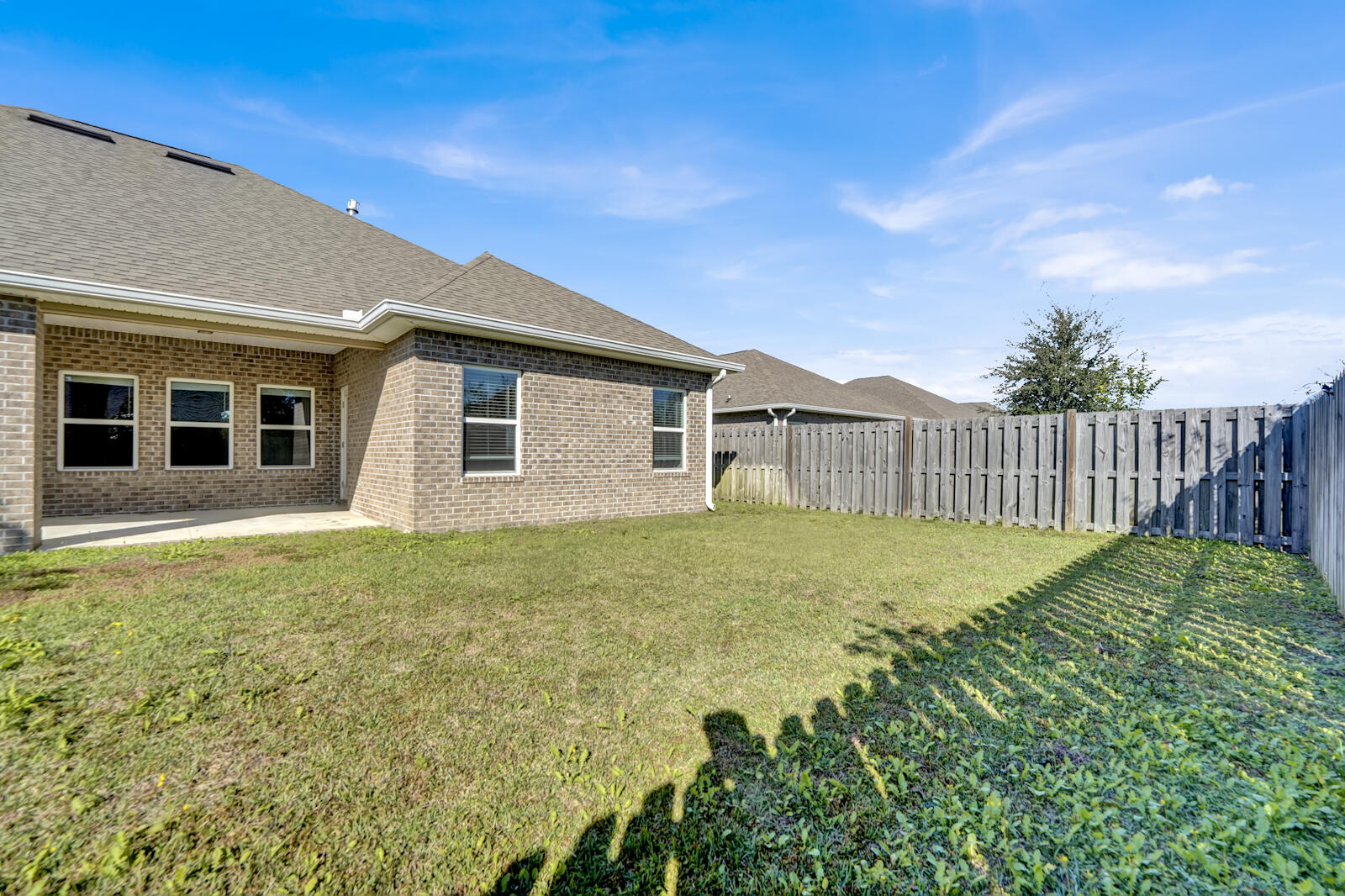 272 Lottie Loop Freeport, FL 32439 - Photo 45 of 53 a view of a backyard with wooden fence