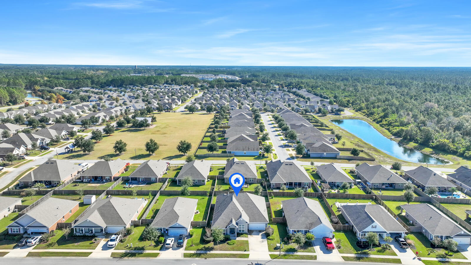 272 Lottie Loop Freeport, FL 32439 - Photo 47 of 53 an aerial view of residential building and parking space