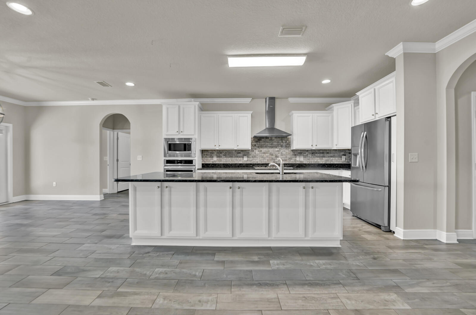 272 Lottie Loop Freeport, FL 32439 - Photo 6 of 53 a kitchen with stainless steel appliances a refrigerator sink and cabinets