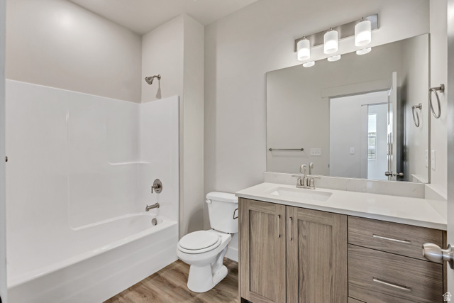 3839 West 825 North, Unit WF18 West Point, UT 84015 - Photo 18 of 22 Bathroom featuring vanity, light wood-style floors, and washtub / shower combination
