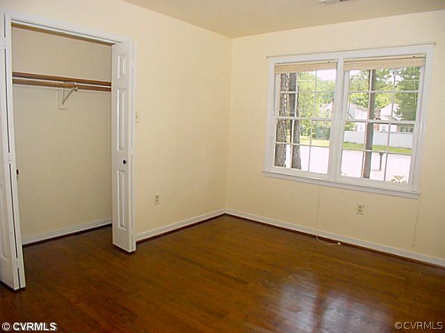 11124 Robious Road North Chesterfield, VA 23235 - Photo 12 of 22 an empty room with wooden floor and windows