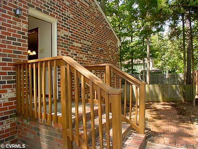 11124 Robious Road North Chesterfield, VA 23235 - Photo 16 of 22 a view of wooden house with a small yard
