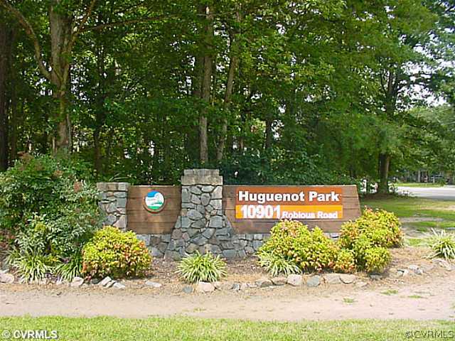 11124 Robious Road North Chesterfield, VA 23235 - Photo 18 of 22 a sign that is sitting on a sidewalk