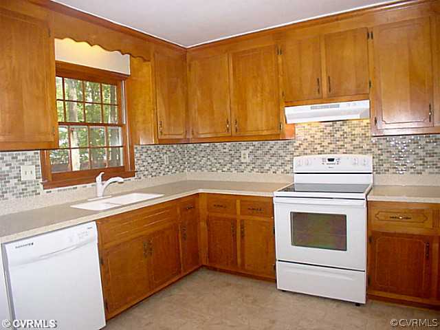 11124 Robious Road North Chesterfield, VA 23235 - Photo 3 of 22 a kitchen with a sink stove and cabinets