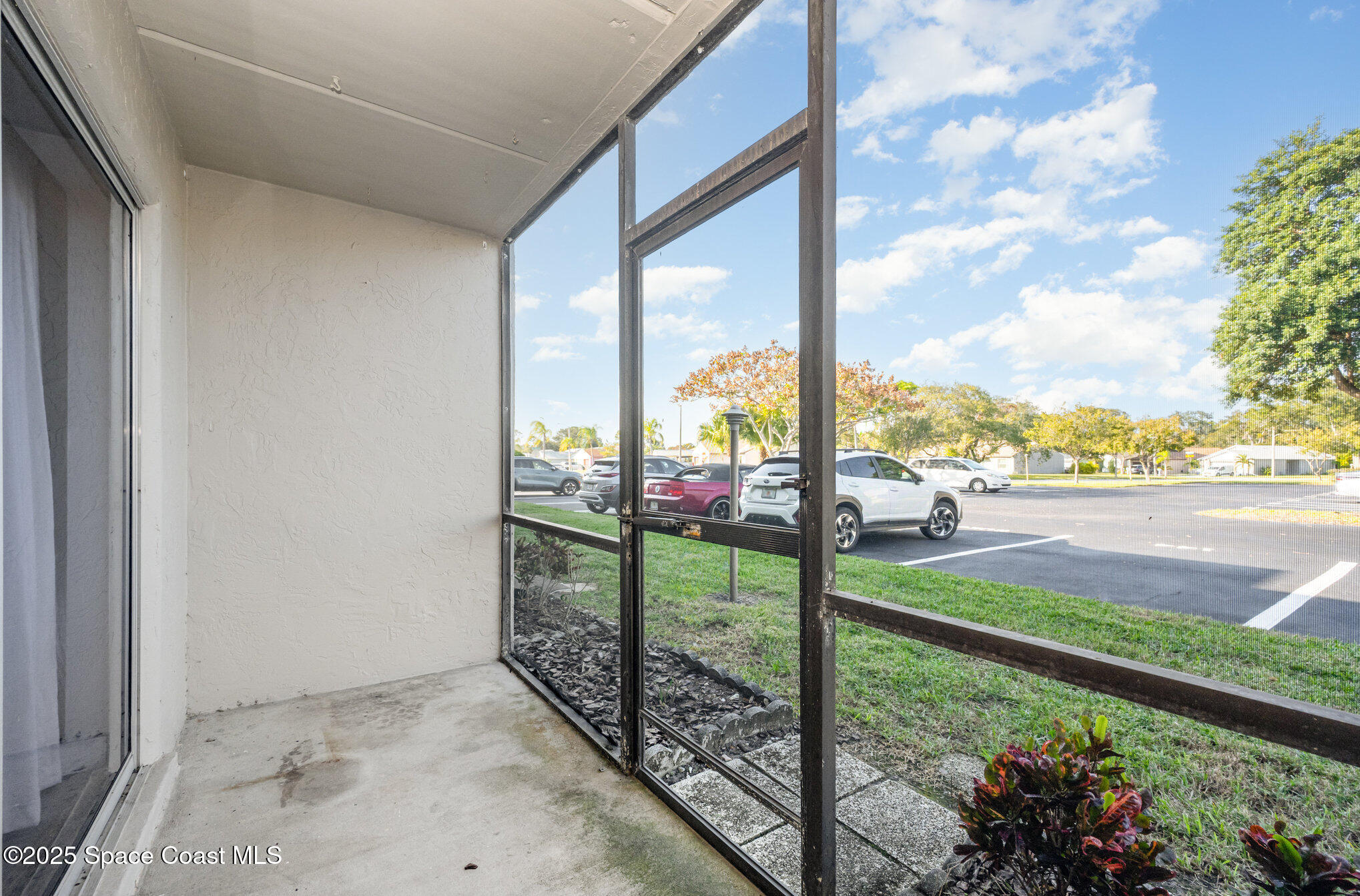 2935 Thrush Drive, Unit 144 Melbourne, FL 32935 - Photo 15 of 17 a view of a street from a balcony