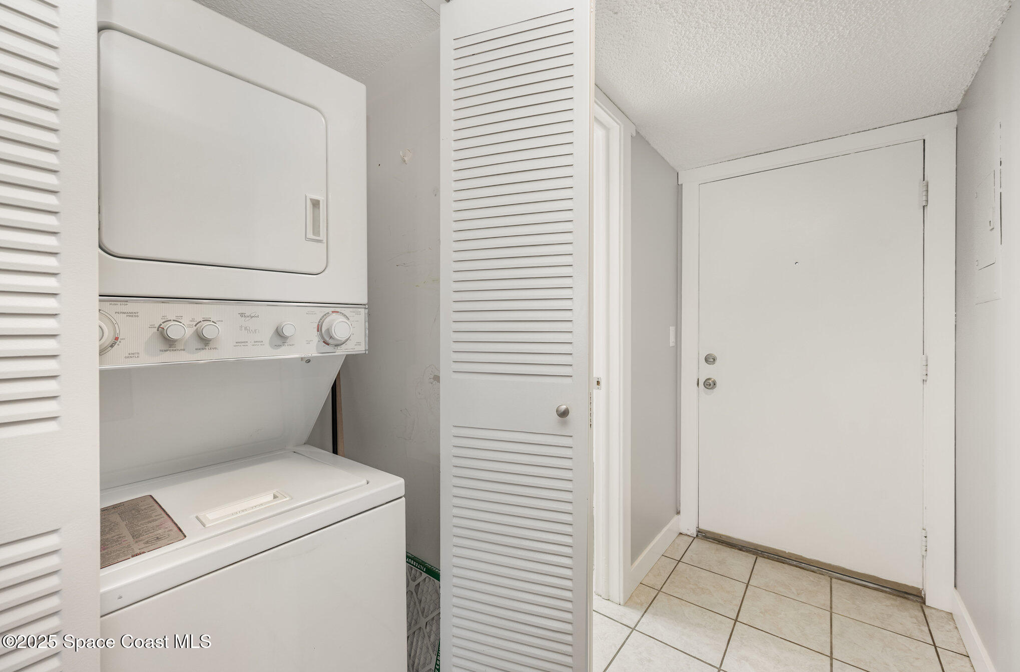 2935 Thrush Drive, Unit 144 Melbourne, FL 32935 - Photo 5 of 17 a view of washer and dryer