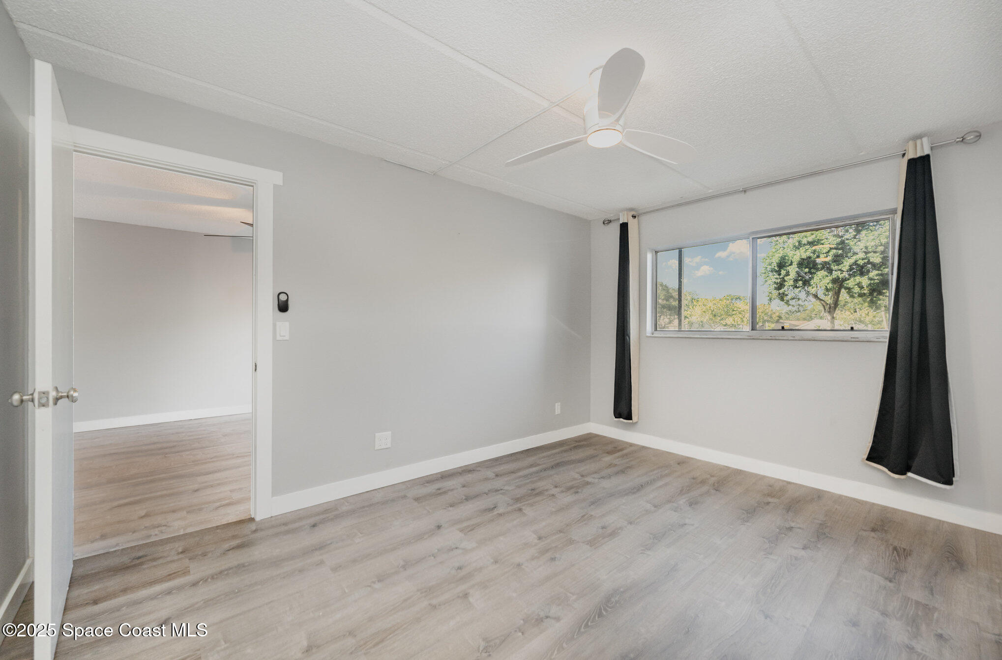 2935 Thrush Drive, Unit 144 Melbourne, FL 32935 - Photo 10 of 17 a view of an empty room with a window