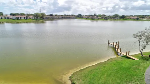 a view of a lake with houses in the back