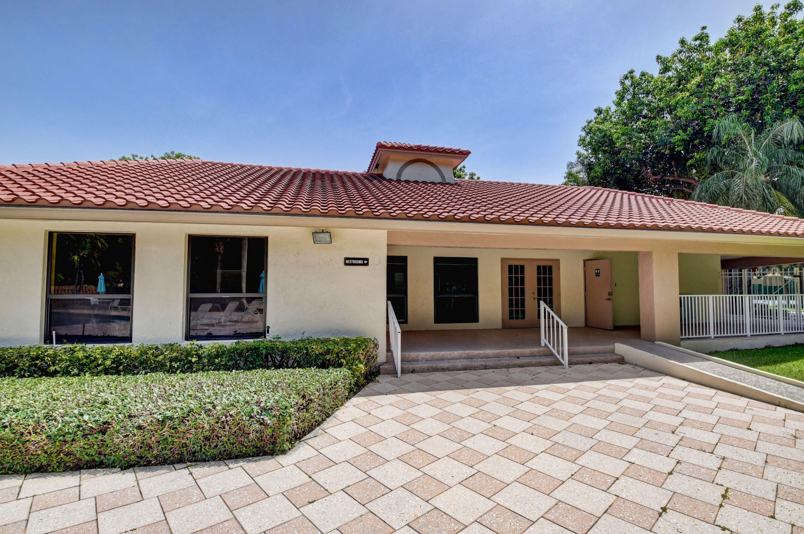 338 Eastwood Terrace Boca Raton, FL 33431 - Photo 21 of 31 a front view of a house with a porch